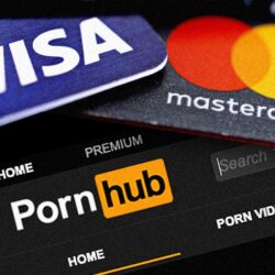 credit cards visa and mastercard placed on top of the pornhub website